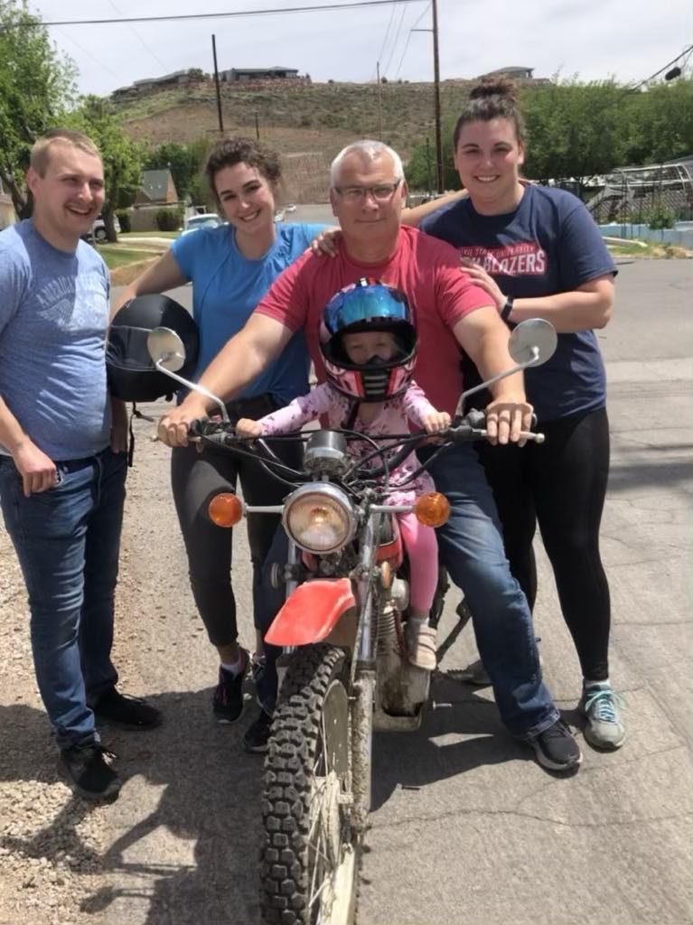 Aaron and his children on his motorcycle